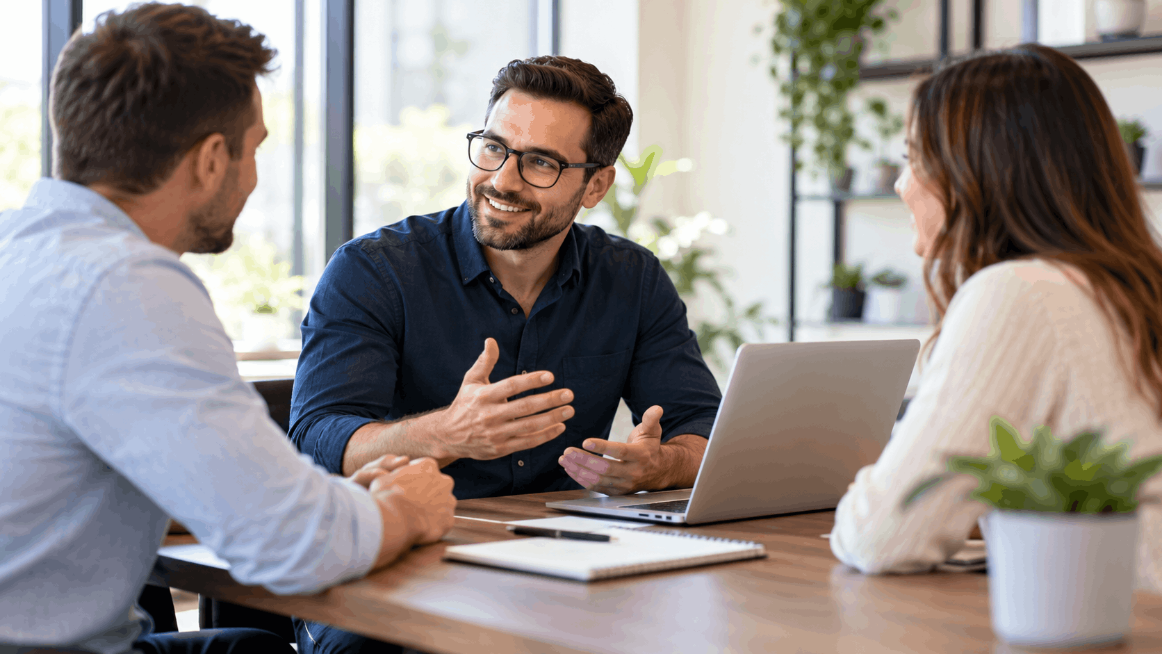 Financial advisor explaining cost options to couple during office consultation meeting