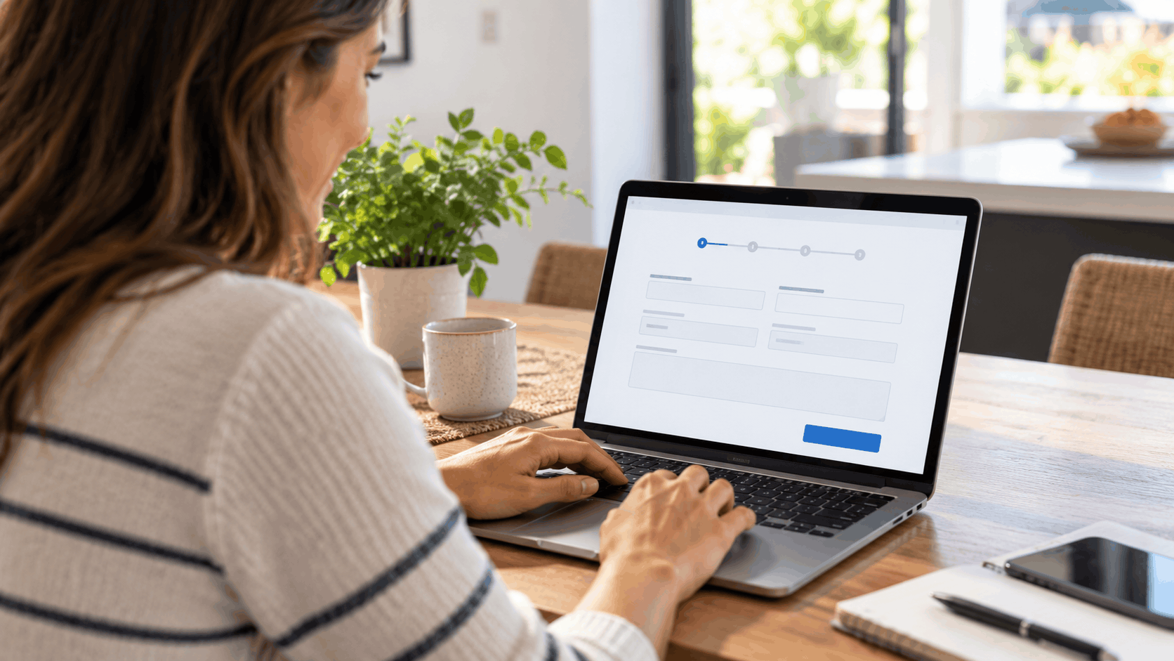 Woman filling out a multi-step online form on laptop at home desk