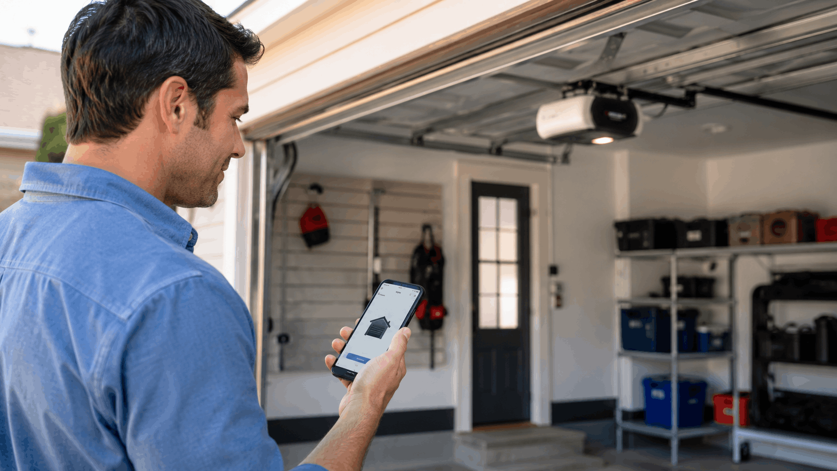 Man using myQ smart garage door opener app on smartphone outside open Irvine garage