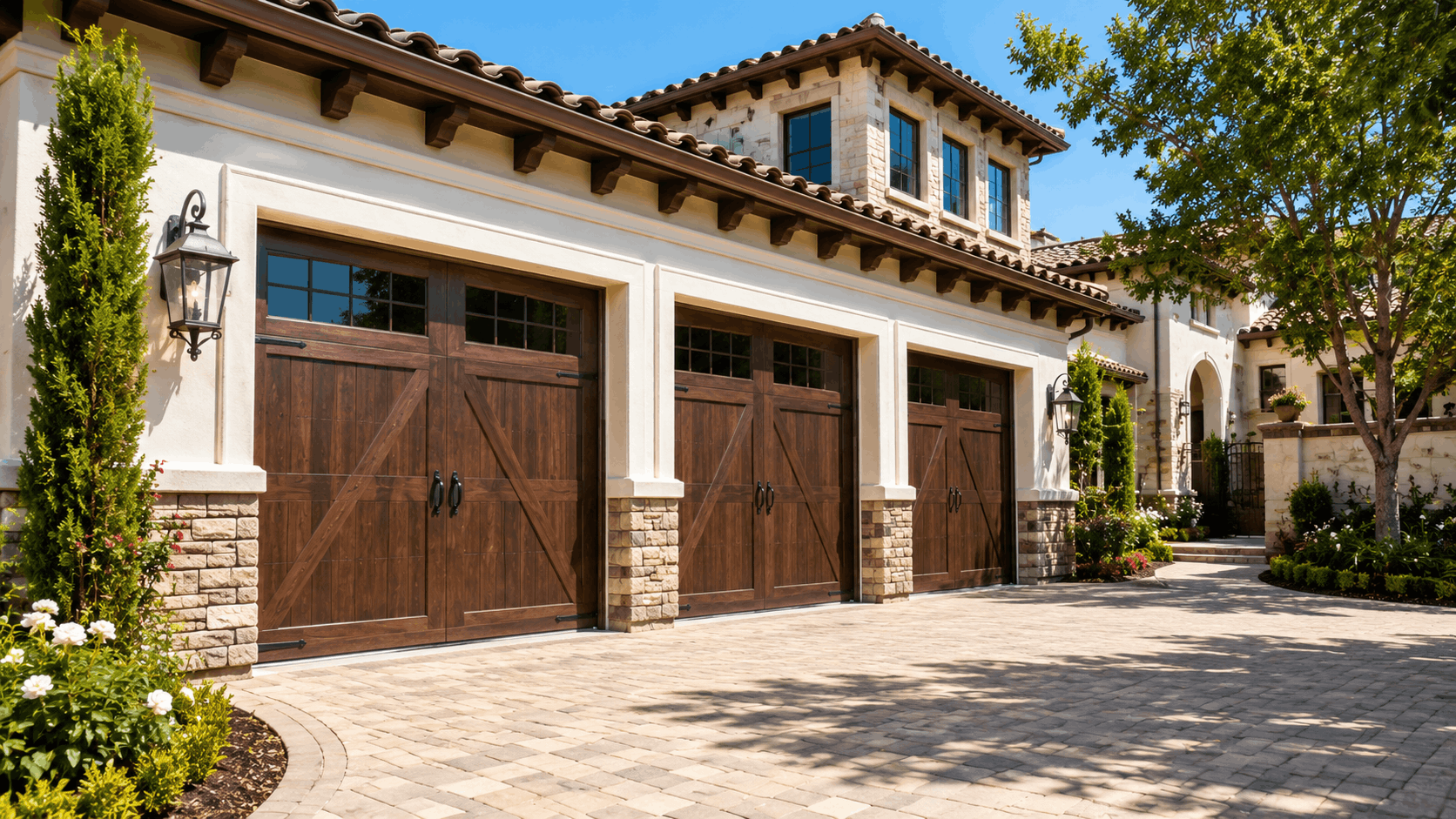 Luxury Mediterranean home with three wooden carriage-style garage doors in Coto de Caza