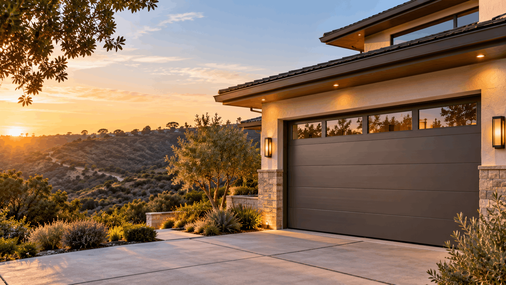 Modern garage door on luxury Irvine hillside home at golden sunset with landscaping