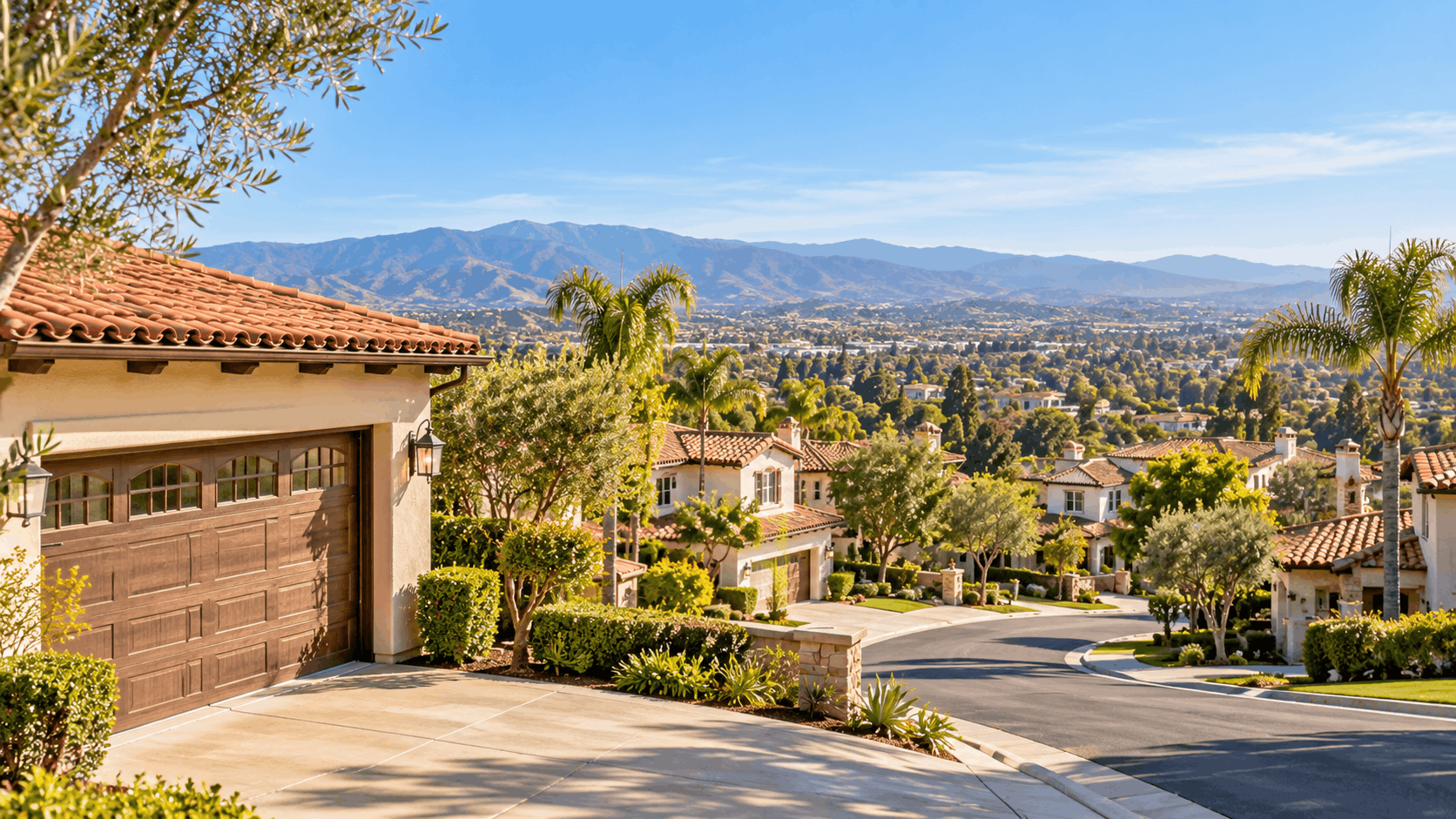 Luxury Irvine homes with Spanish tile roofs and wooden garage doors