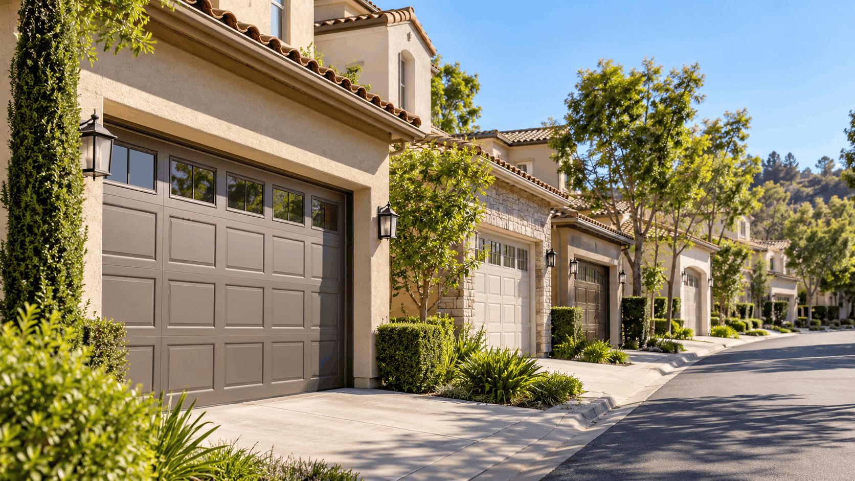 Northwood Irvine Mediterranean homes with tan garage doors and manicured landscaping