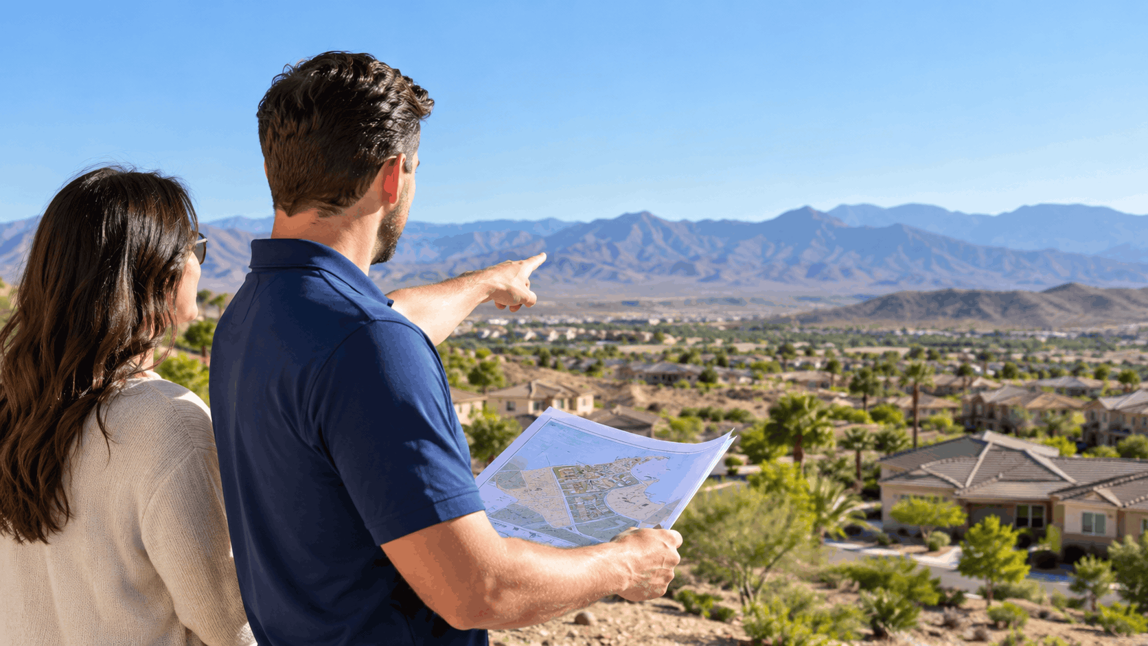Couple reviewing plumbing blueprints overlooking Summerlin Las Vegas residential neighborhood and mountains